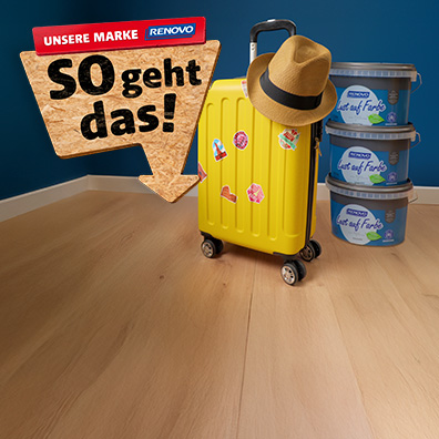 Gelber Koffer und ein Stapel RENOVO Farben rechts daneben.